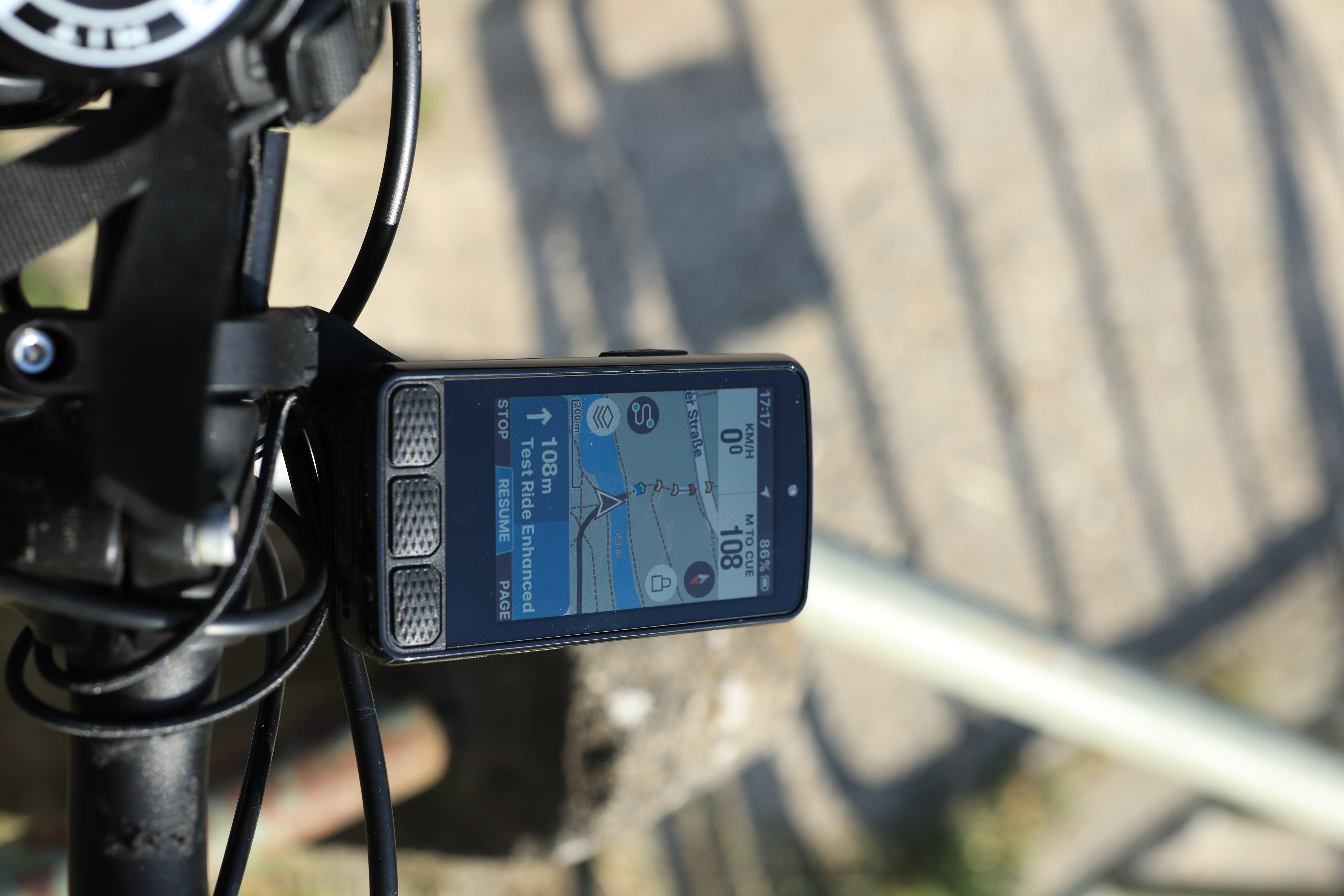 A Wahoo cycling computer up close mounted on a bike. It shows the planned route on the map.