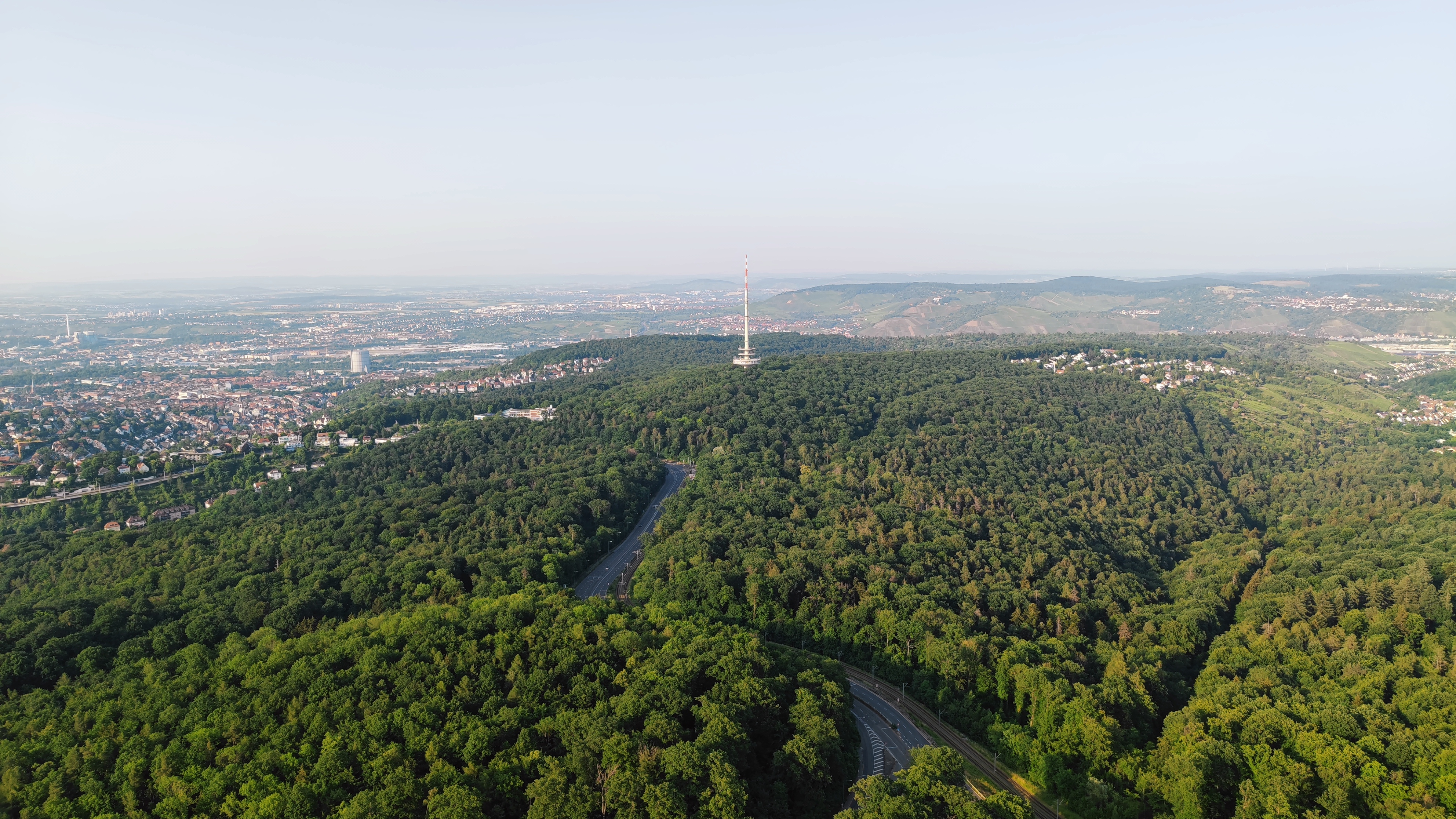 Panorama from a tower on a hill.In the middle, another hill with another tower is visible.