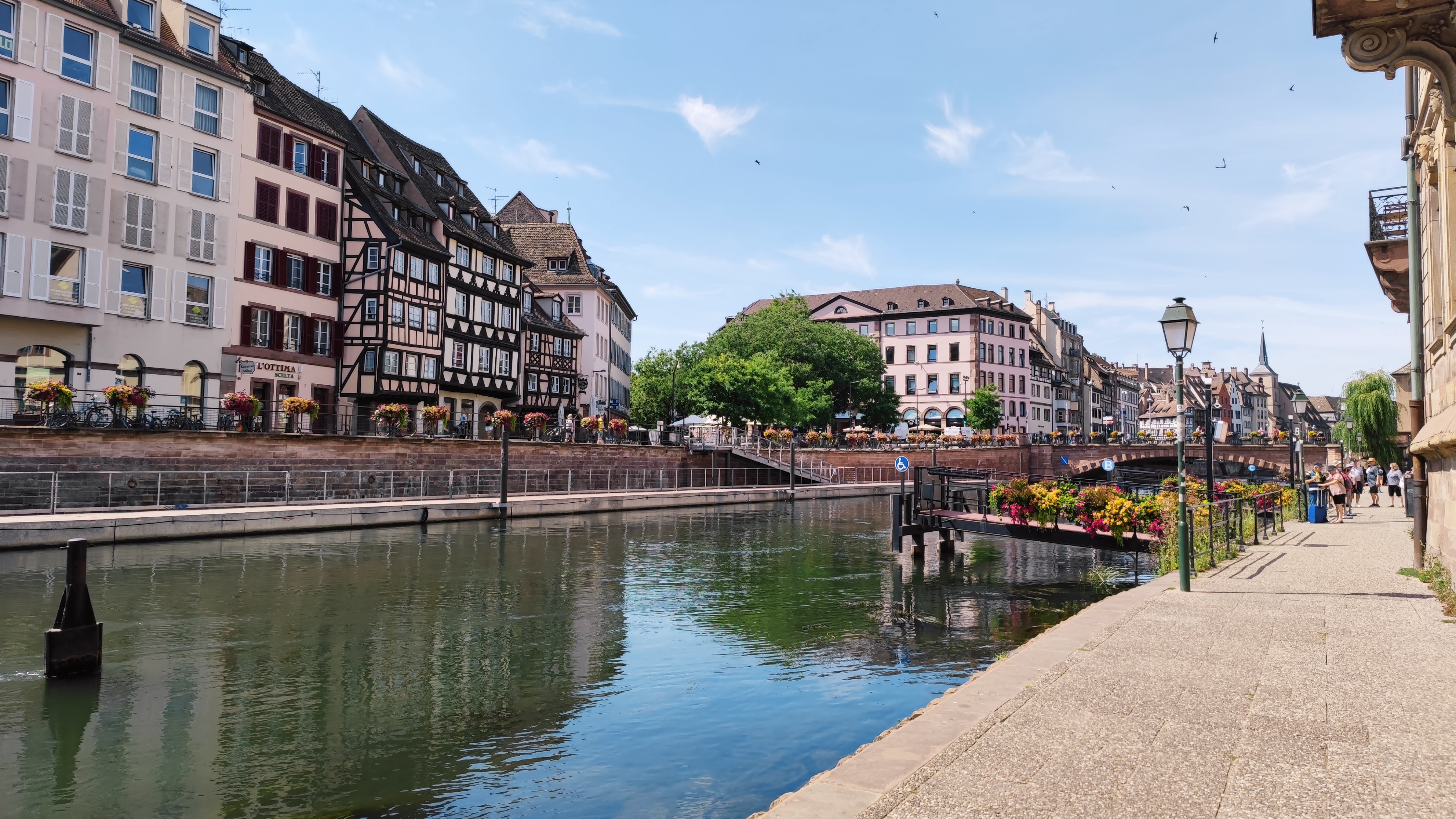 A canal in between colorful traditional buildings.